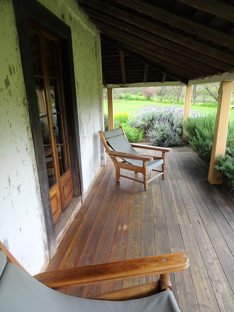 Dundullimal near Dubbo. Squatters chairs on the low slung veranda roof. Dundullimal was built in 1842 using slab construction. Now a National Trust property.