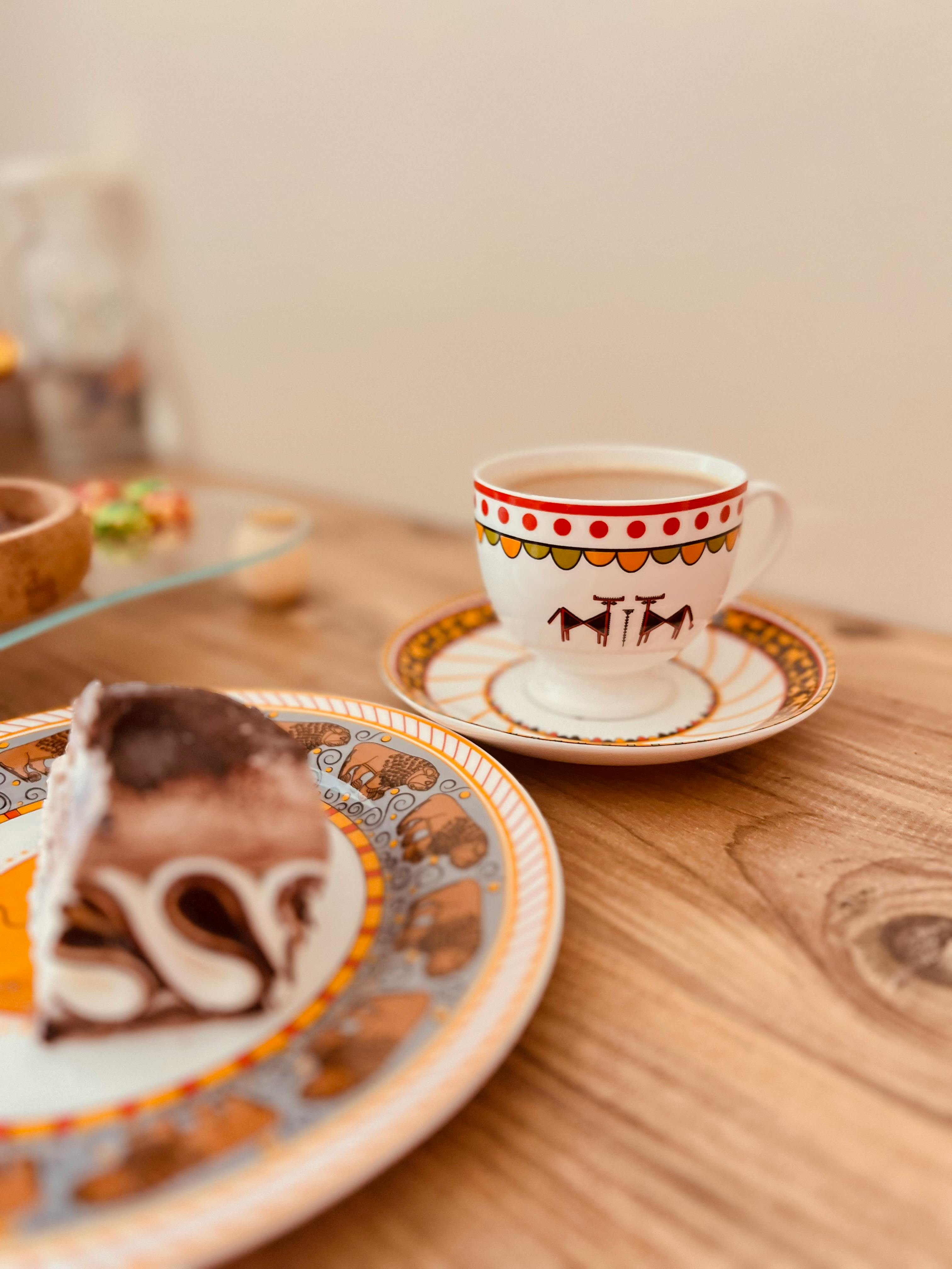 Elegant Turkish tea cup and dessert on intricately decorated plates, Ankara, Türkiye.