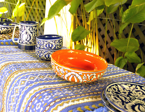 Cotton Rugs with Kutchi weaves, Blue Pottery items on top
