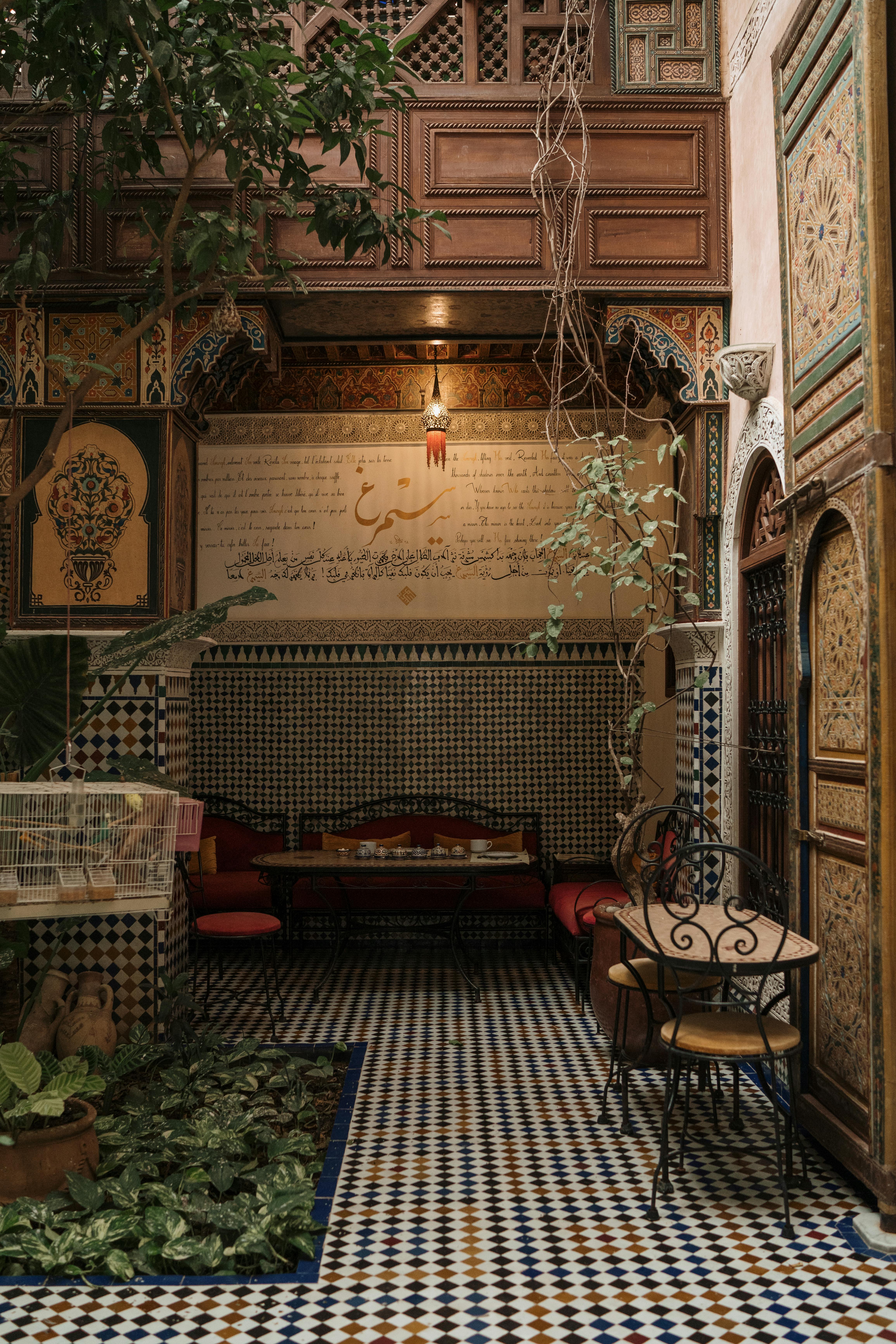 Cozy Moroccan courtyard with traditional Islamic design elements and vibrant decor.