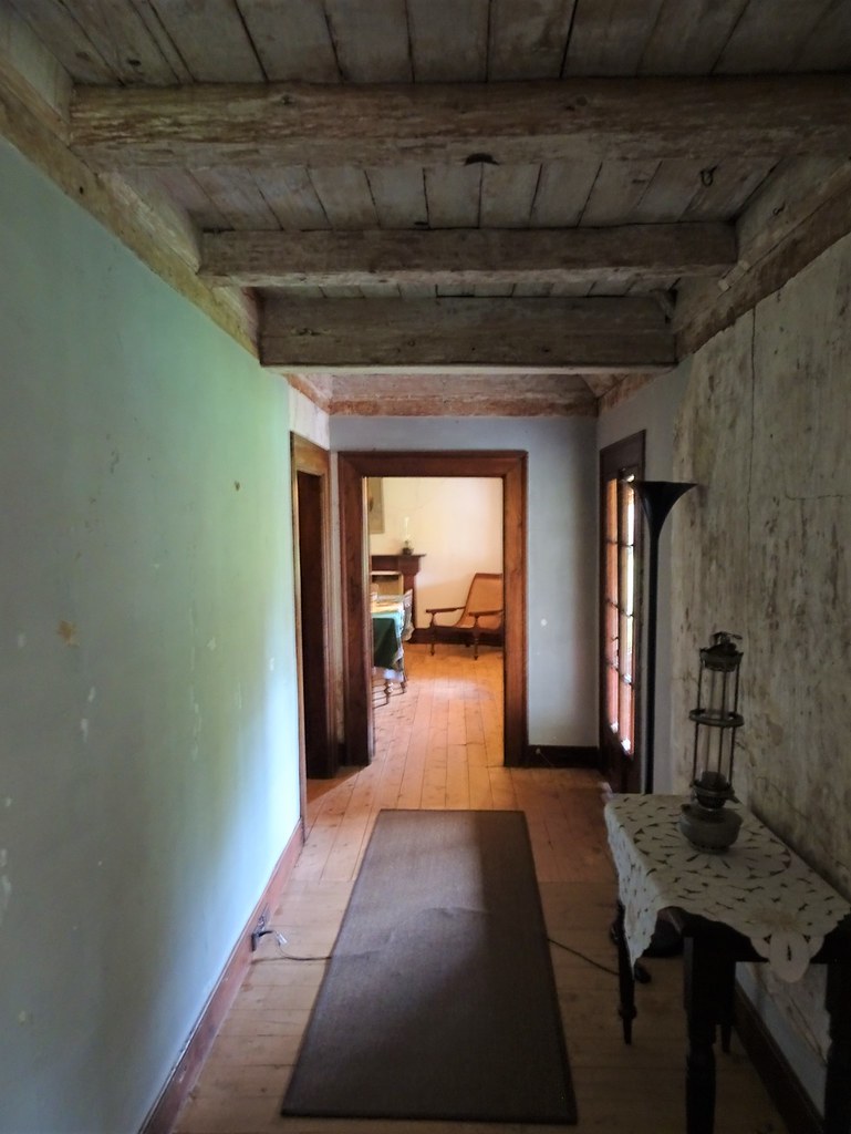 Dubbo. Dundullimal slab built homestead. 1842. Note the massive rough hewn roof timbers.
