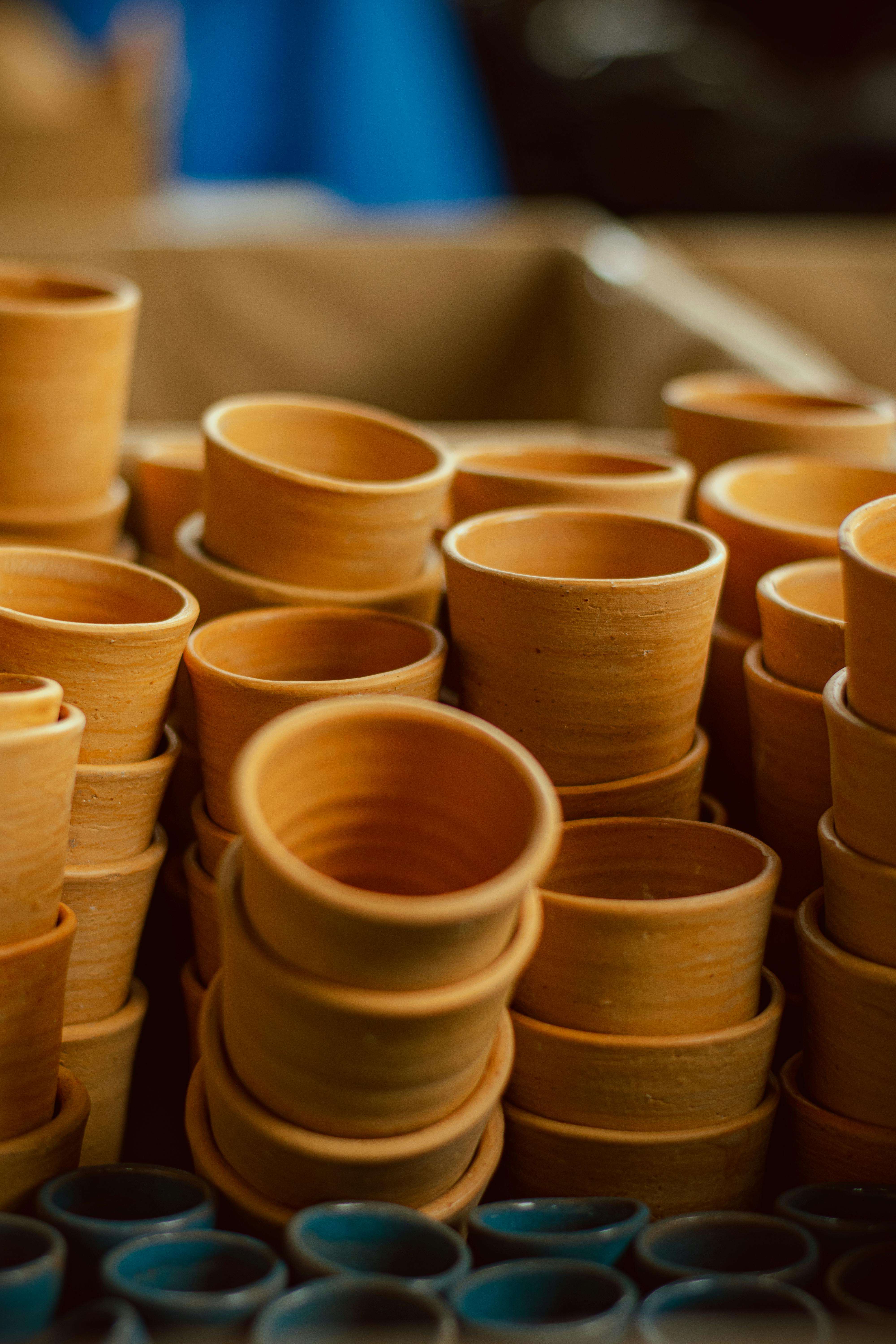 Close-up of stacked terracotta clay pots showcasing artisan craftsmanship.