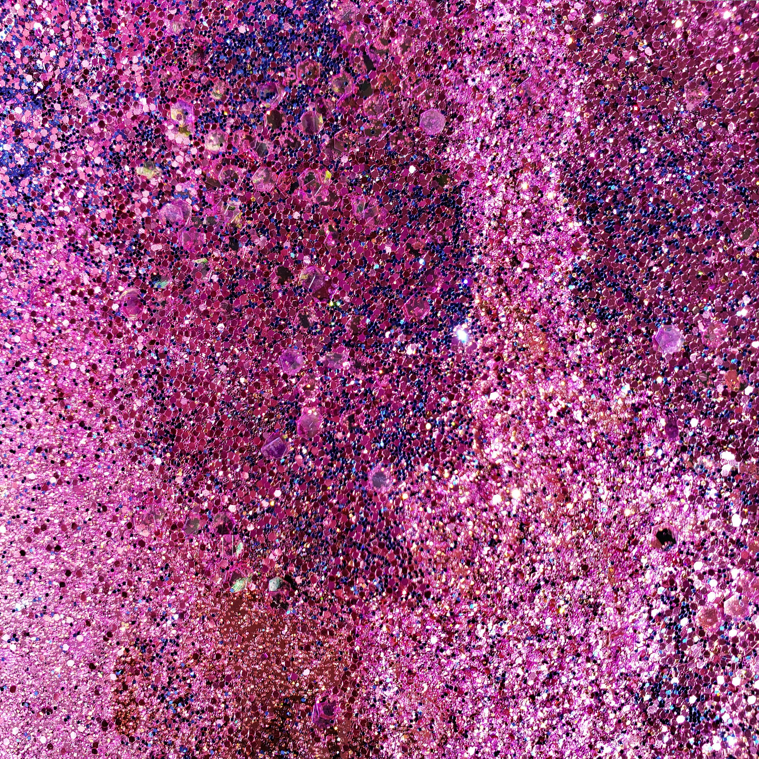 Vivid abstract texture featuring shades of purple and pink creating a rough, artistic background.